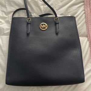 Never used Michael kors navy messenger bag